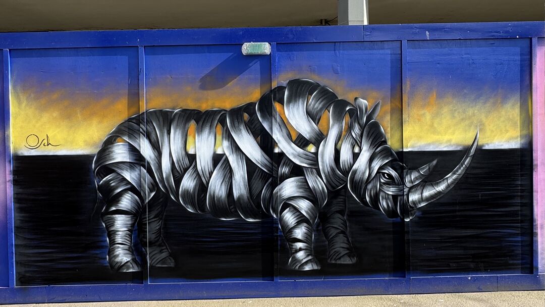 Ribboned Rhino by OTTO SCHADE, Harlow Town, West Gate